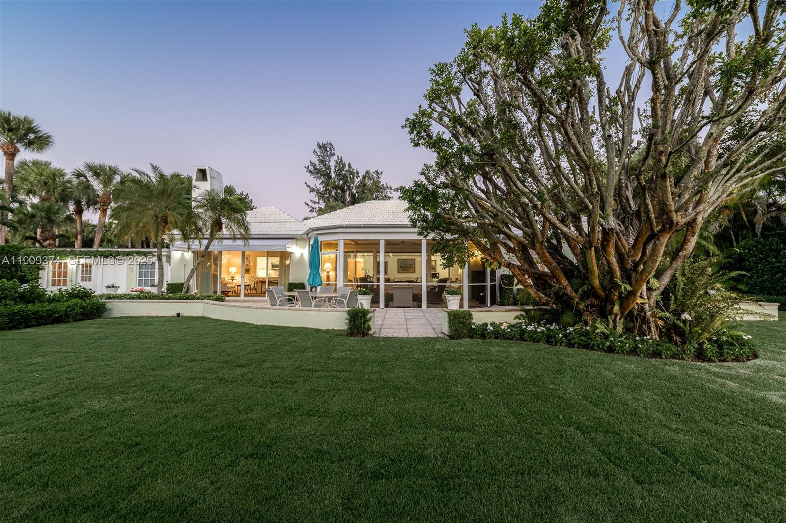 18 Gomez Road Jupiter Island, FL 33455 - Photo 28 of 34 a front view of a house with garden and porch