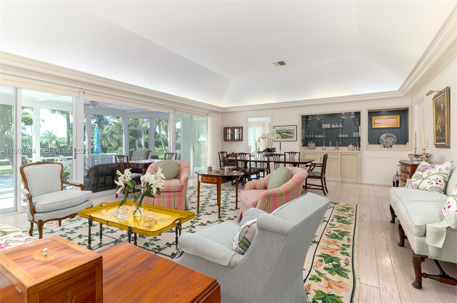 18 Gomez Road Jupiter Island, FL 33455 - Photo 9 of 34 a living room with furniture fireplace and a table
