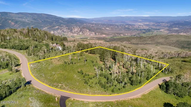 a view of a swimming pool with a yard and mountain view