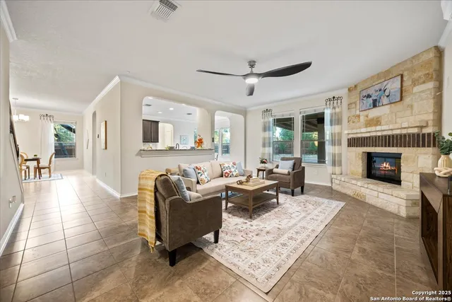 a living room with furniture and a fireplace