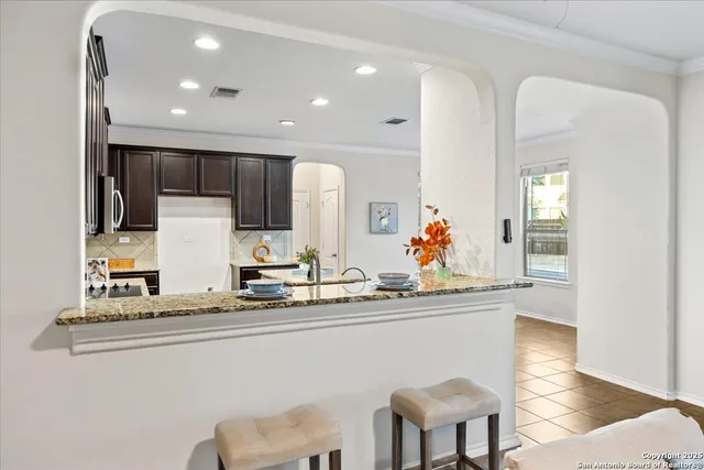 a dining room with furniture and window