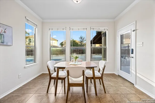 a kitchen with kitchen island granite countertop lots of counter top space and refrigerator