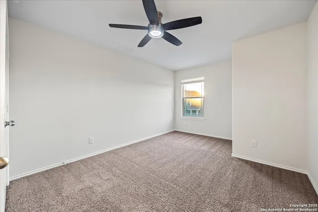 a bathroom with a granite countertop sink a toilet a mirror a bathtub and shower