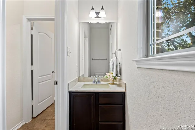 an empty room with glass door and furniture