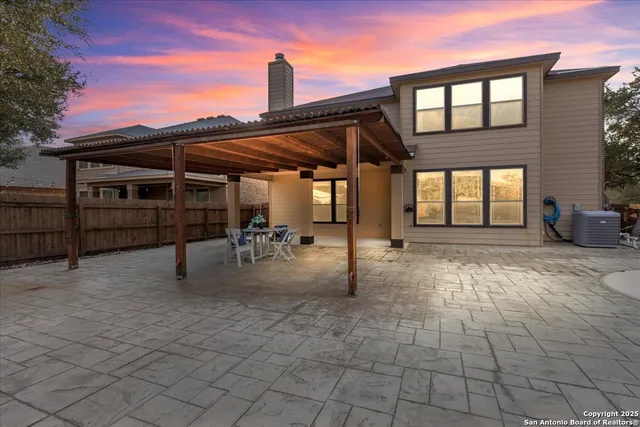 a front view of a house with fountain