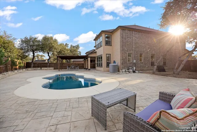 a view of a swimming pool with a patio