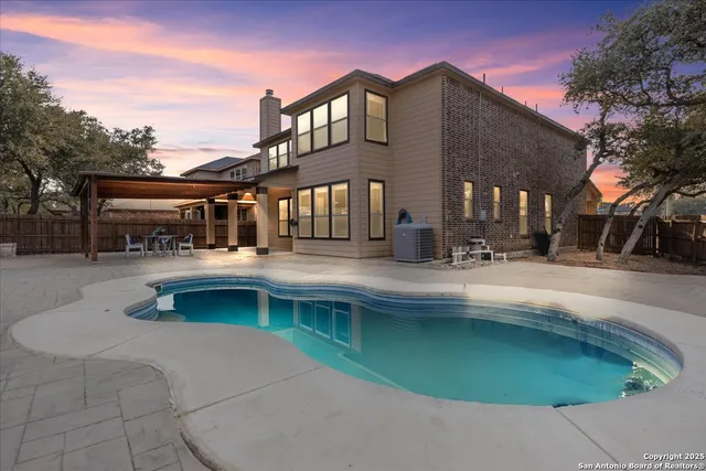 a view of a house with roof and sitting area