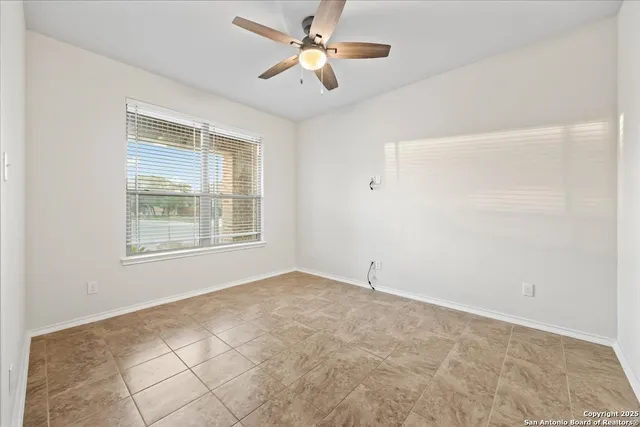 a view of a dining room with furniture and window