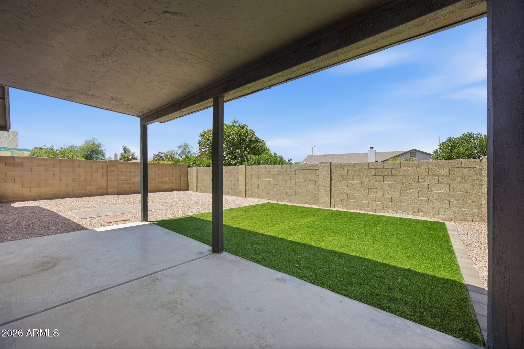 3134 East McKellips Road, Unit 69 Mesa, AZ 85213 - Photo 22 of 24 a view of a backyard