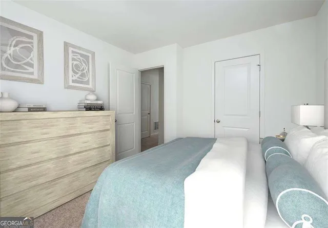 a bedroom with a bed and cabinet