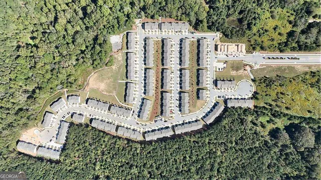 a aerial view of a house with a yard