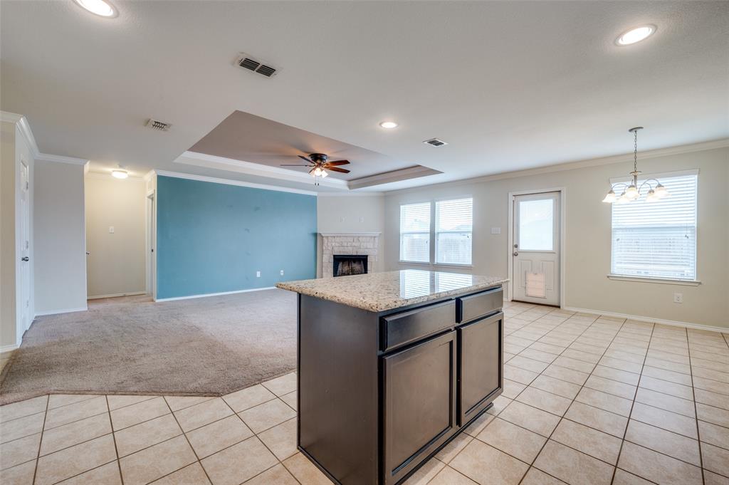 1420 Rivers Creek Lane Little Elm, TX 75068 - Photo 8 of 25 a kitchen with granite countertop a sink and a stove top oven