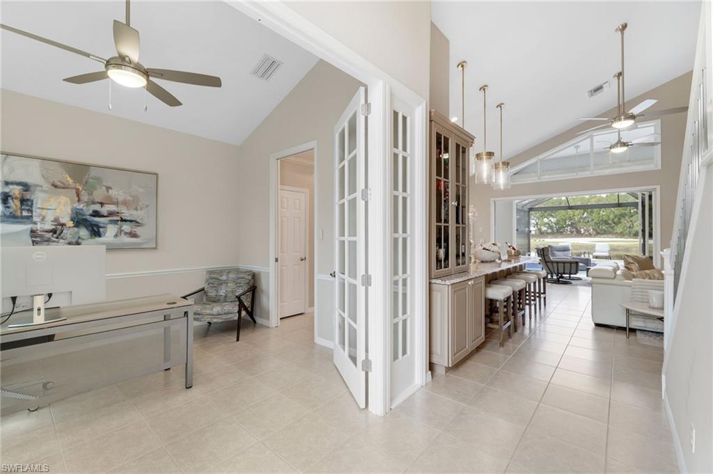 17959 Modena Road Miromar Lakes, FL 33913 - Photo 15 of 48 a living room with furniture and a large window