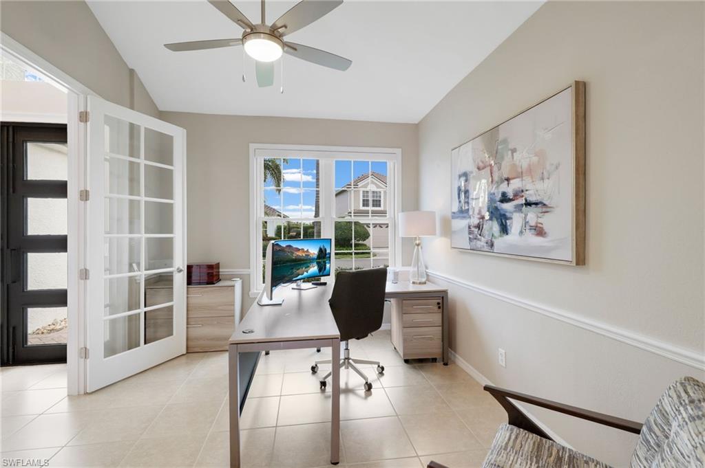 17959 Modena Road Miromar Lakes, FL 33913 - Photo 16 of 48 a view of a workspace with furniture and a window