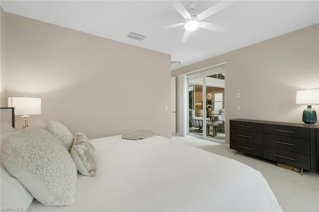 17959 Modena Road Miromar Lakes, FL 33913 - Photo 17 of 48 a bedroom with a bed and a dresser