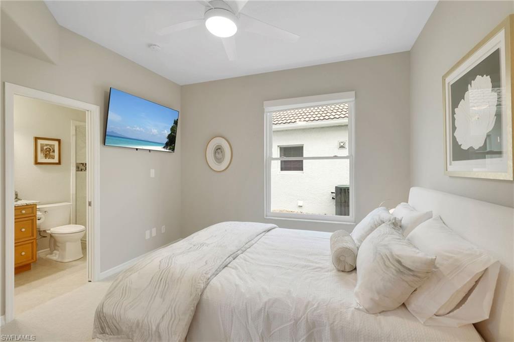 17959 Modena Road Miromar Lakes, FL 33913 - Photo 21 of 48 a bedroom with a bed and a painting on the wall