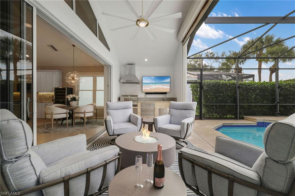 17959 Modena Road Miromar Lakes, FL 33913 - Photo 25 of 48 a living room with furniture and a large window