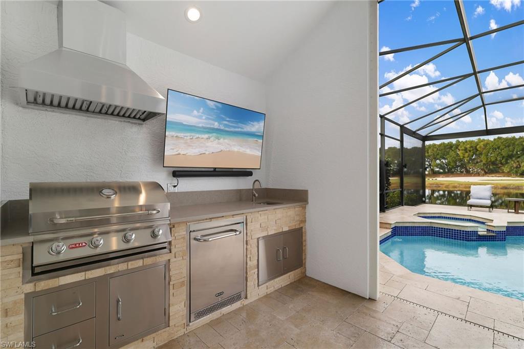 17959 Modena Road Miromar Lakes, FL 33913 - Photo 27 of 48 a kitchen with stainless steel appliances granite countertop a sink and a stove