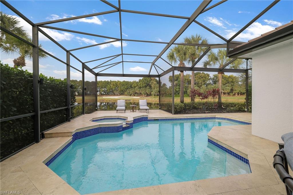 17959 Modena Road Miromar Lakes, FL 33913 - Photo 28 of 48 a view of a swimming pool with a patio