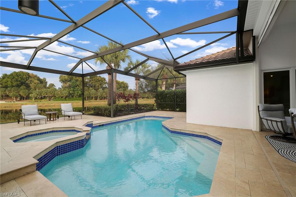 17959 Modena Road Miromar Lakes, FL 33913 - Photo 33 of 48 a view of a swimming pool with a patio