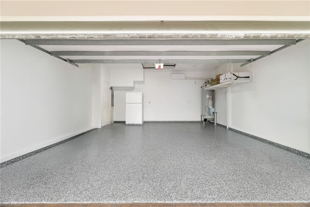 17959 Modena Road Miromar Lakes, FL 33913 - Photo 41 of 48 a view of a garage
