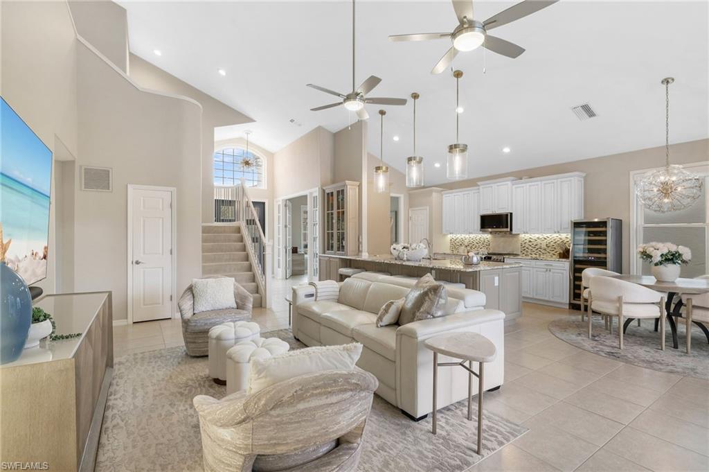 17959 Modena Road Miromar Lakes, FL 33913 - Photo 8 of 48 a living room with furniture kitchen view and a chandelier