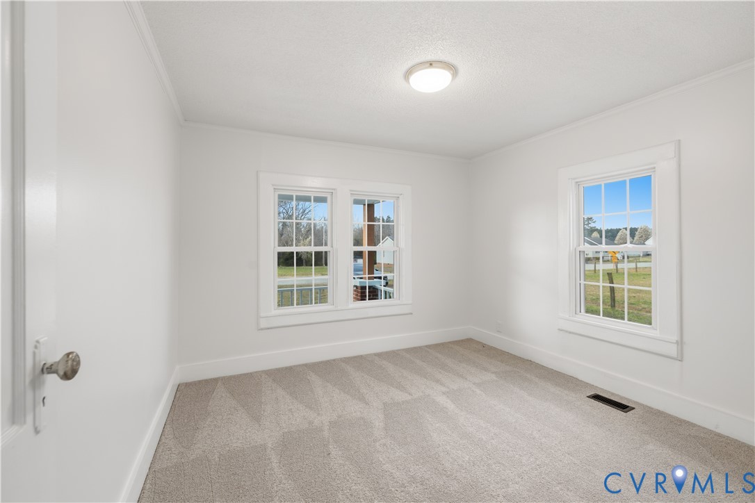 239 Brunswick Road Emporia, VA 23847 - Photo 10 of 24 Light gray carpeting