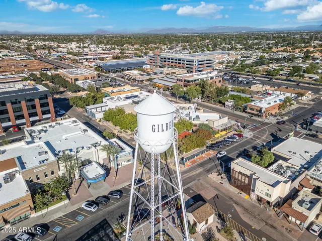 an aerial view of a residential building and an outdoor space