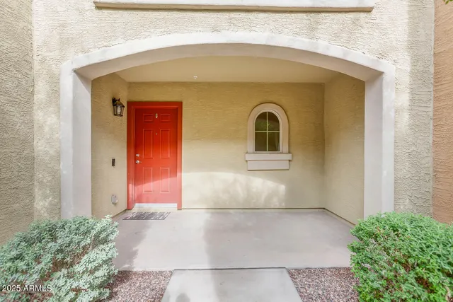 a front view of a house with large windows
