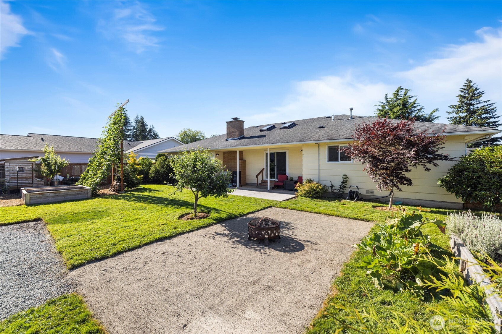 415 Sterling Street Sedro-Woolley, WA 98284 - Photo 27 of 38 a view of a house with backyard and sitting area