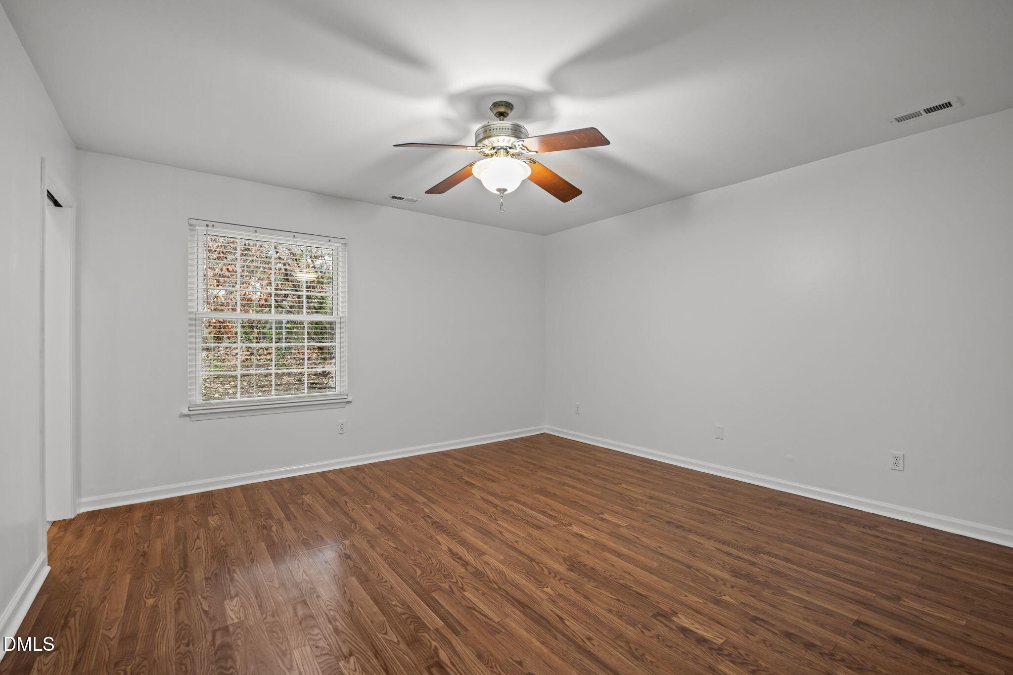 3333 Jo Anne Drive Raleigh, NC 27603 - Photo 15 of 24 wooden floor in an empty room with a window