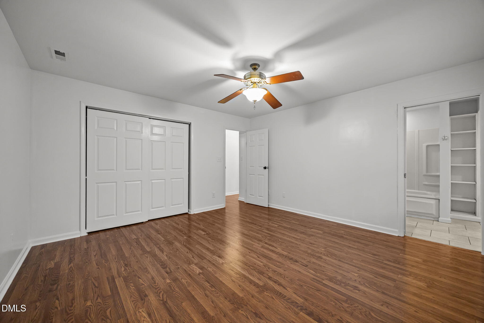 3333 Jo Anne Drive Raleigh, NC 27603 - Photo 16 of 24 a view of an empty room with wooden floor