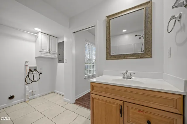 a bathroom with a sink and mirror
