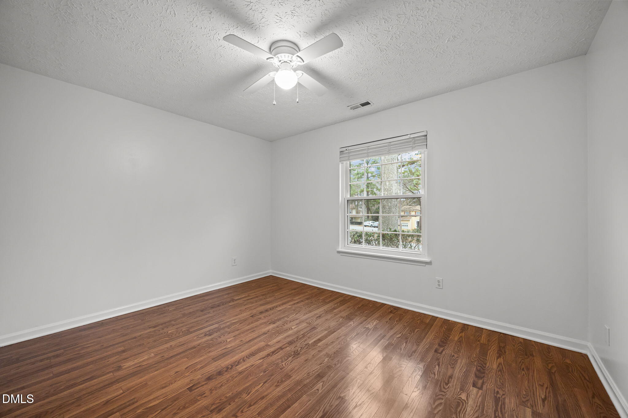 3333 Jo Anne Drive Raleigh, NC 27603 - Photo 19 of 24 an empty room with wooden floor and windows