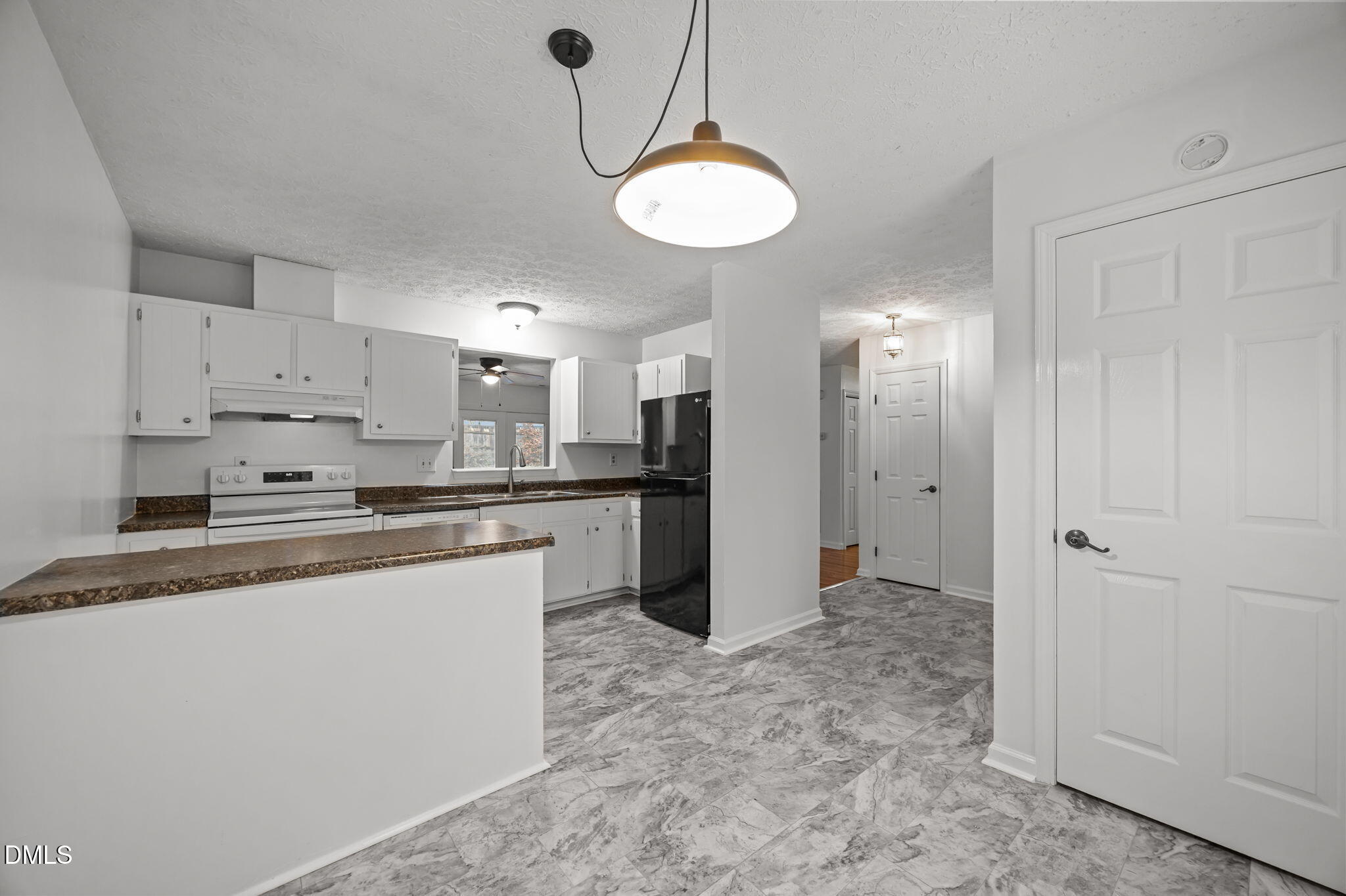 3333 Jo Anne Drive Raleigh, NC 27603 - Photo 5 of 24 a kitchen with stainless steel appliances a refrigerator sink and cabinets