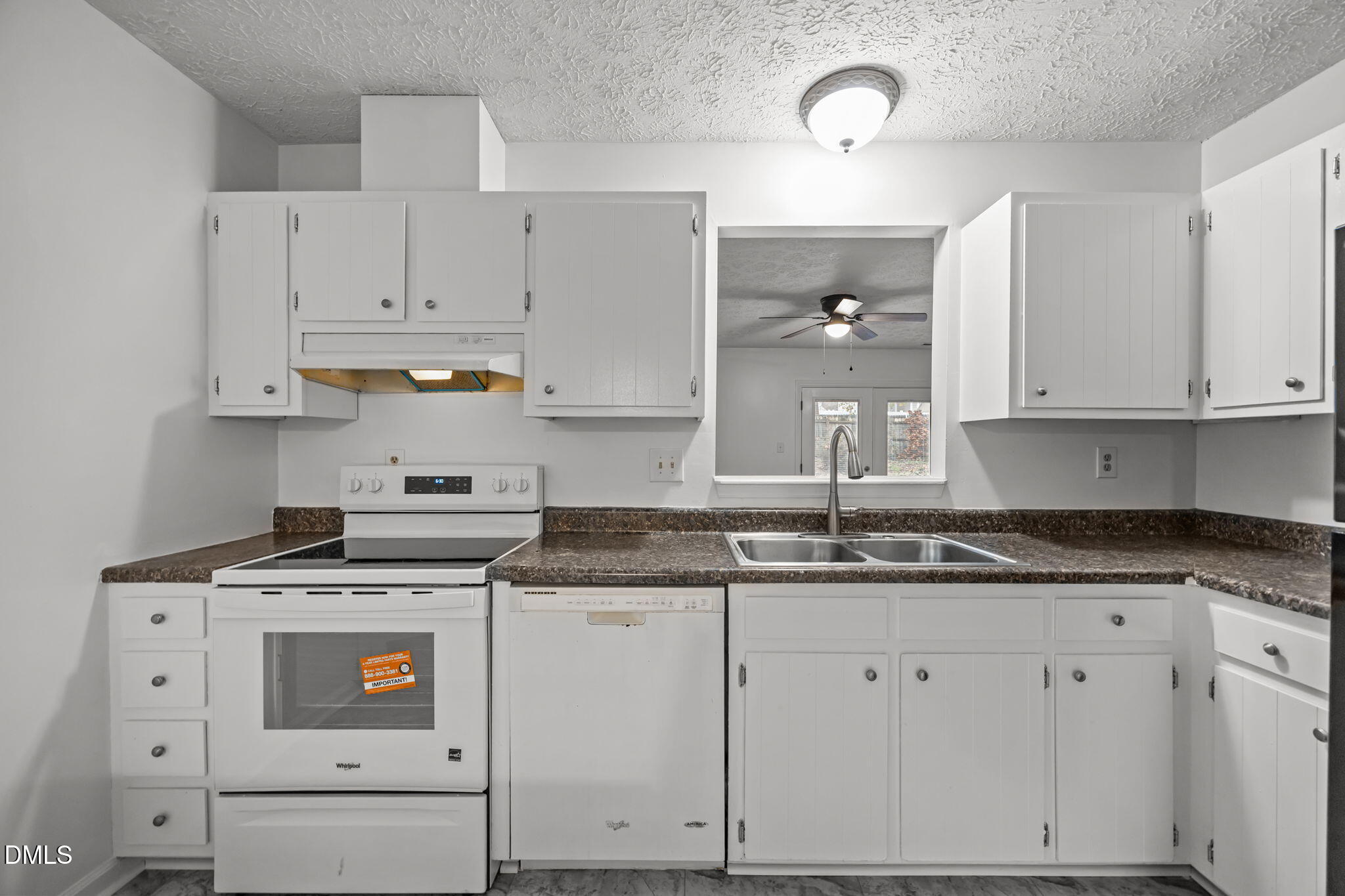 3333 Jo Anne Drive Raleigh, NC 27603 - Photo 6 of 24 a kitchen with granite countertop white cabinets and white appliances