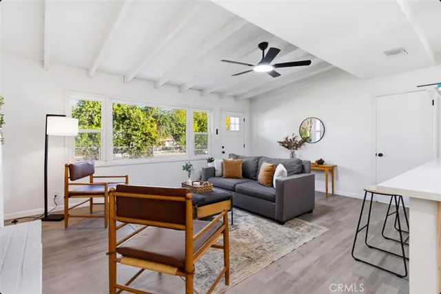 a living room with furniture and a window