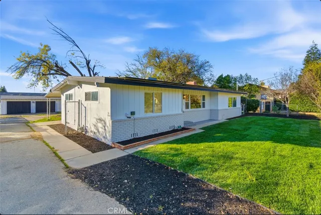 a front view of a house with garden