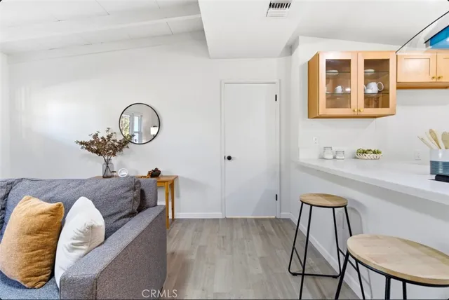 a living room with furniture and a potted plant