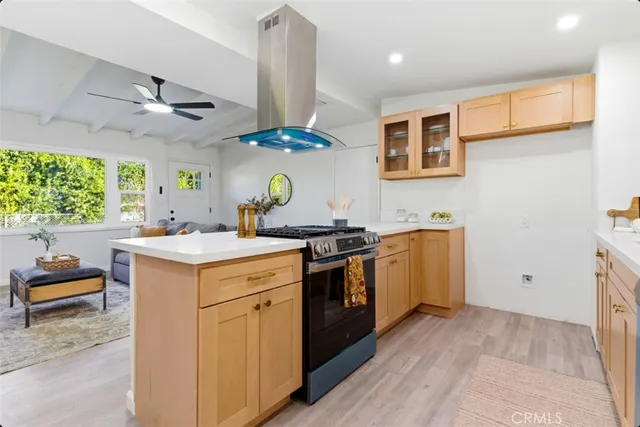 a kitchen with a sink cabinets and window