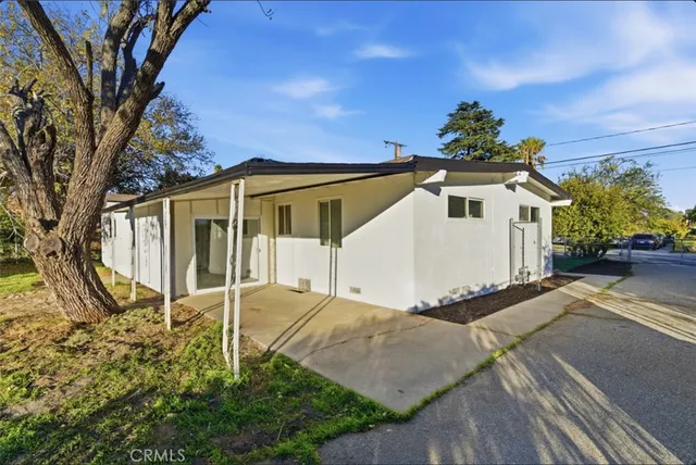 a front view of a house with a yard and a garage