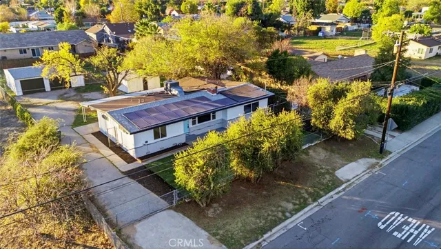 an aerial view of residential houses with outdoor space