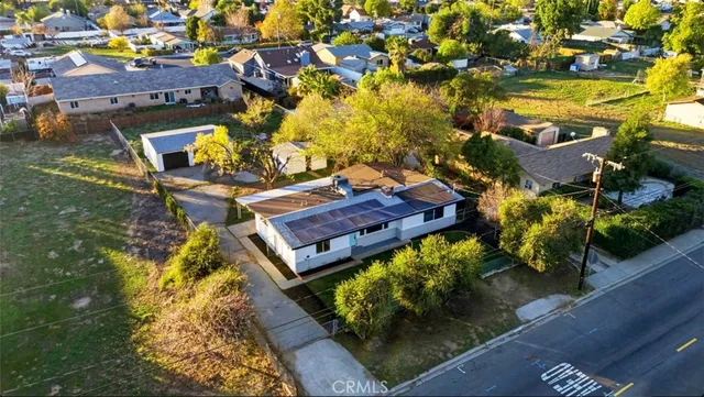 an aerial view of residential houses with outdoor space