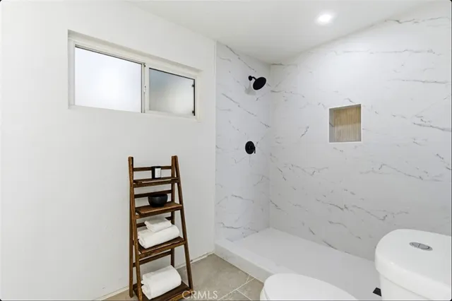 a bathroom with a bathtub and shower