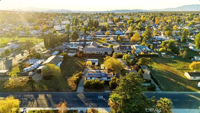 an aerial view of residential houses and outdoor space