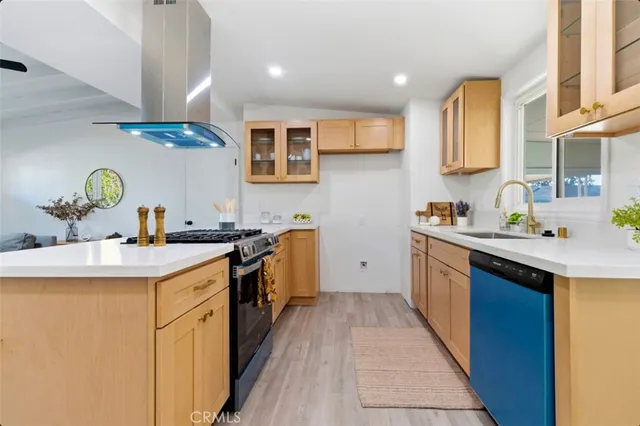 a kitchen with a sink stove and cabinets