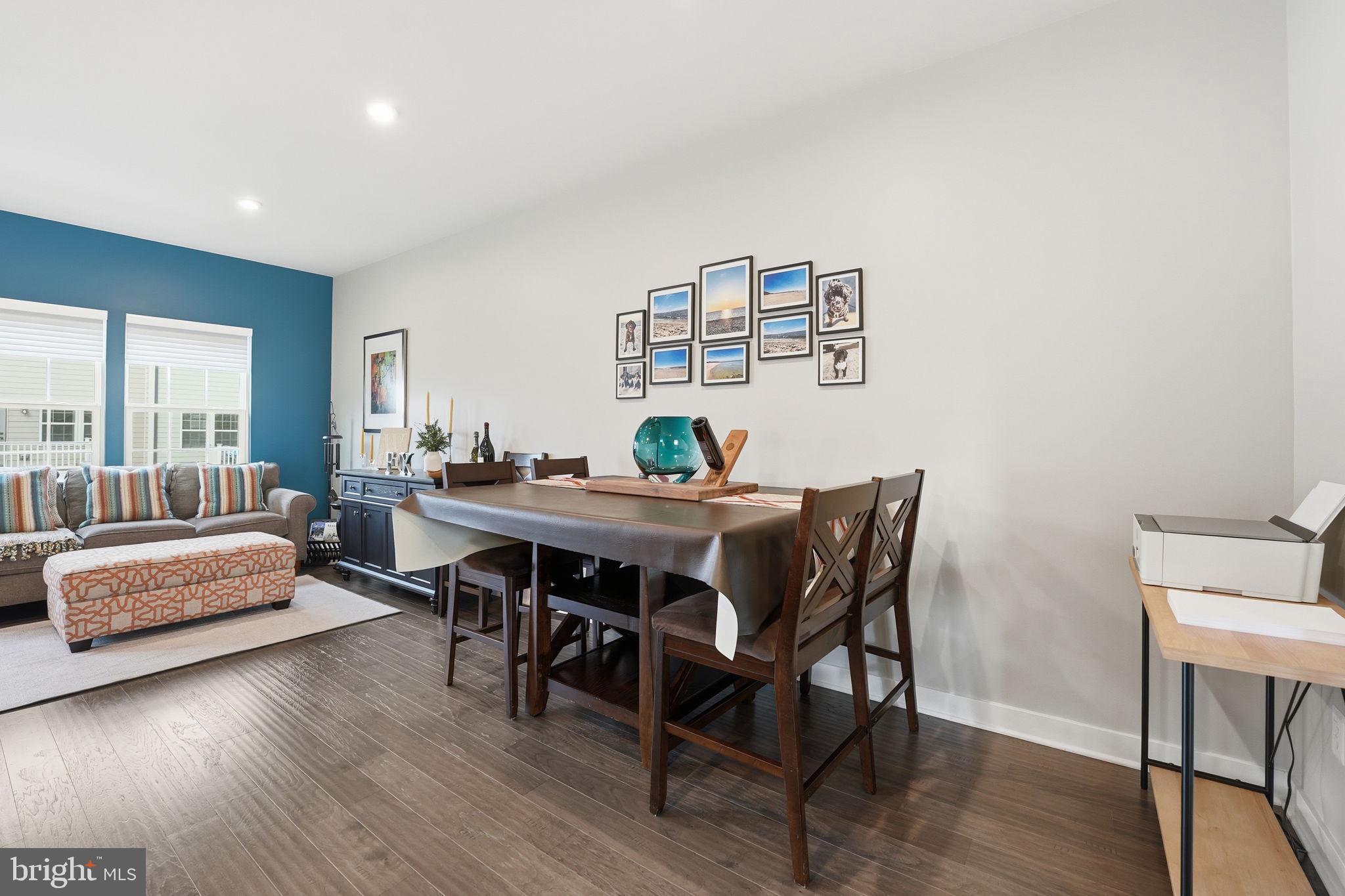 18112 Red Cedar Road Dumfries, VA 22026 - Photo 14 of 69 a view of a dining room with furniture and wooden floor