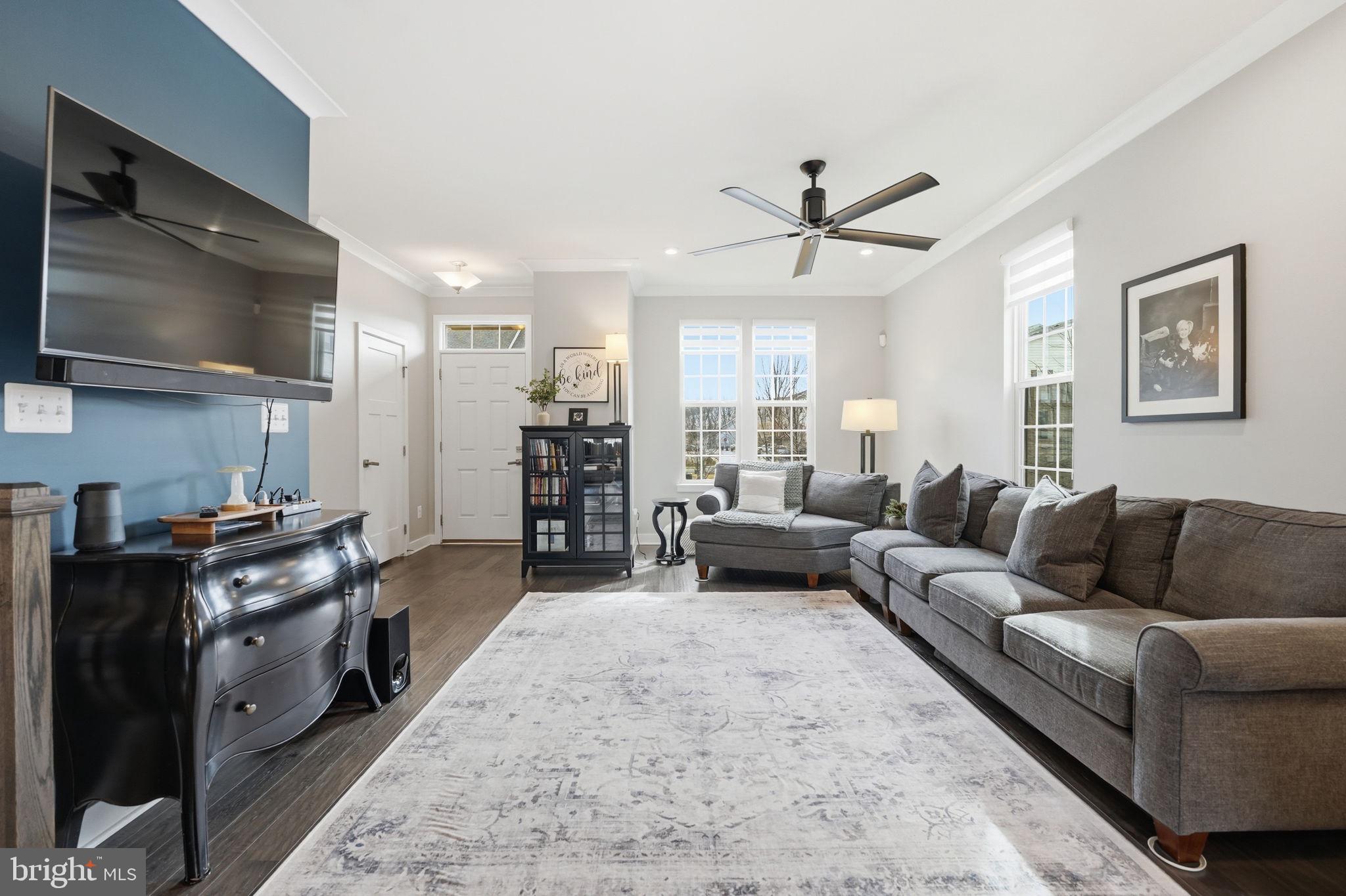 18112 Red Cedar Road Dumfries, VA 22026 - Photo 16 of 69 a living room with furniture and a flat screen tv