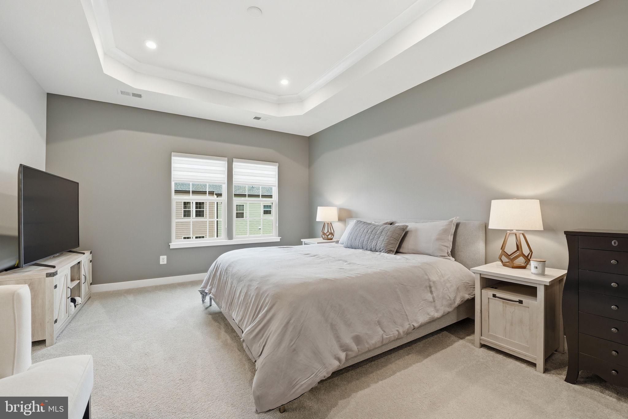 18112 Red Cedar Road Dumfries, VA 22026 - Photo 20 of 69 a bedroom with bed a flat tv screen and a dresser