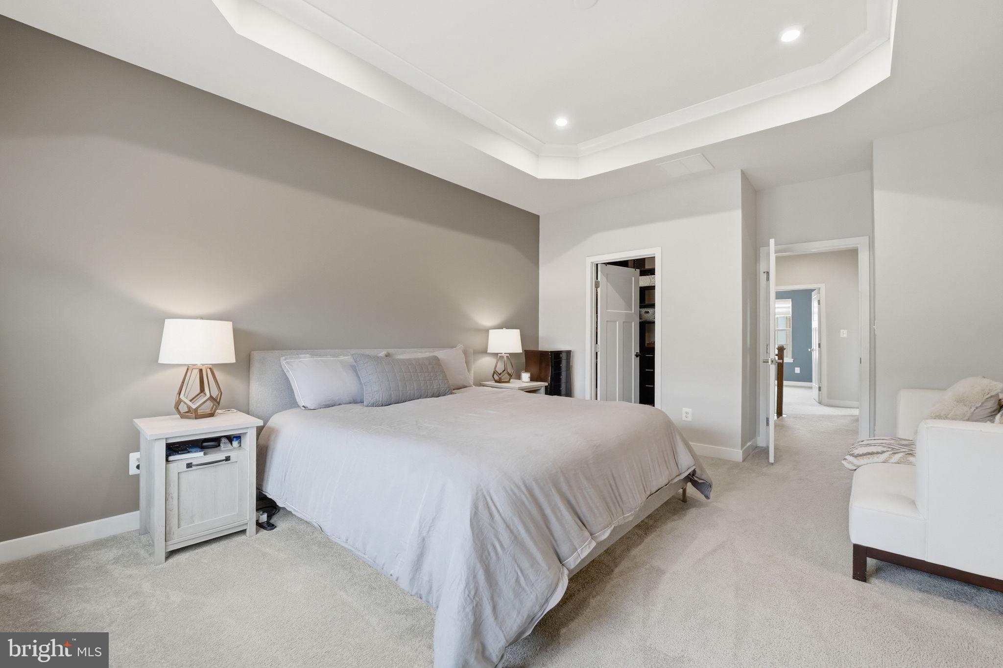 18112 Red Cedar Road Dumfries, VA 22026 - Photo 21 of 69 a bedroom with a bed and a lamp